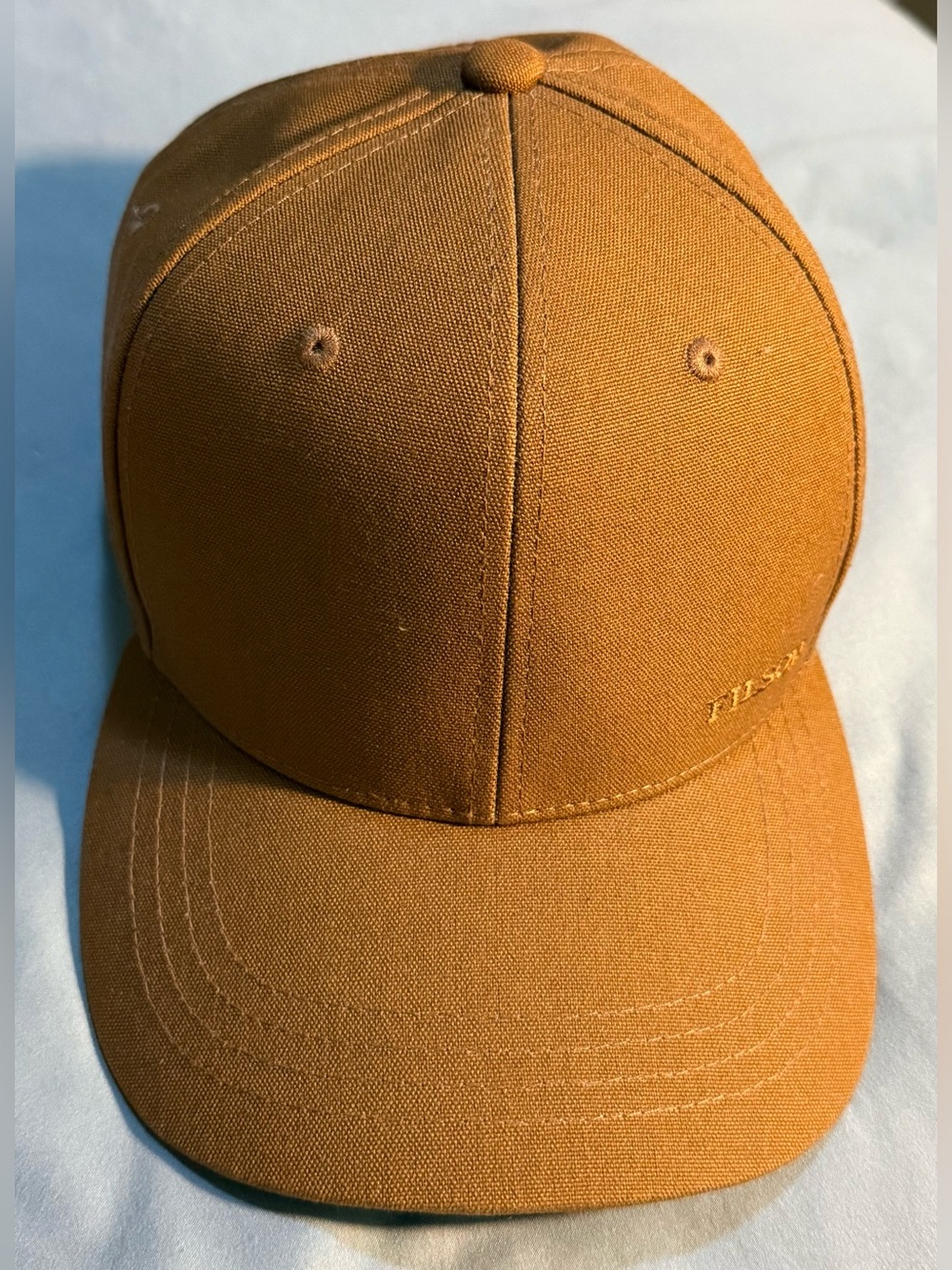 C.C. Filson Dry Tin Logger Cloth Whiskey Brown Leather Strap Back Mens Hat Cap
